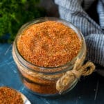 Cajun seasoning in a jar made with a blend of herbs and spices.