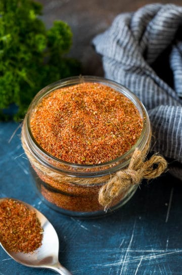 Cajun seasoning in a jar made with a blend of herbs and spices.
