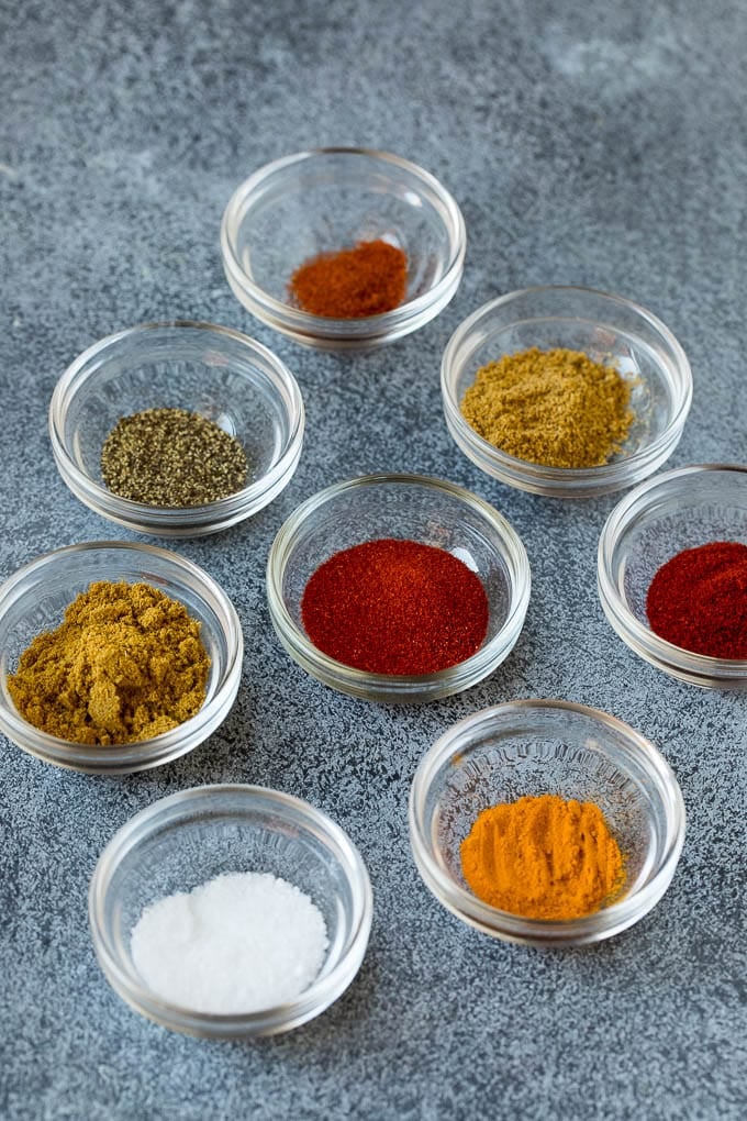 Assorted spices in small bowls.