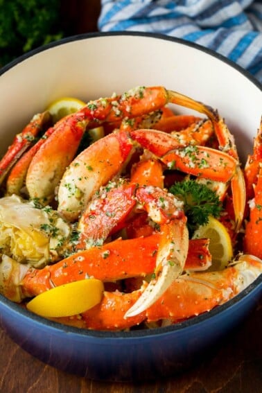 A pot of crab legs tossed in garlic butter.
