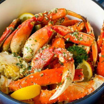 A pot of crab legs tossed in garlic butter.