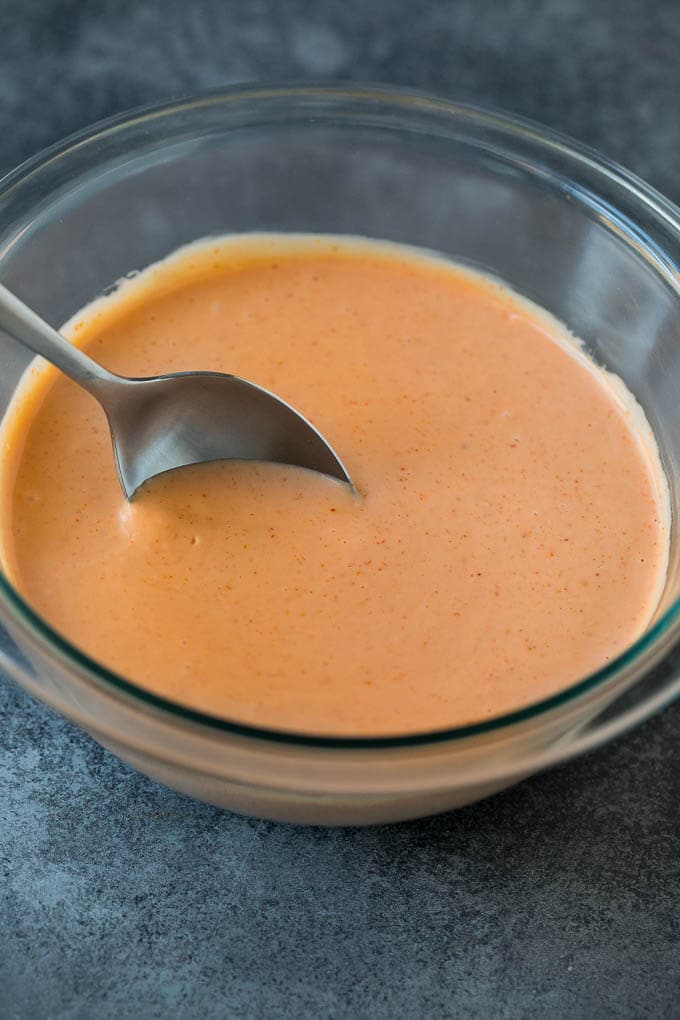 Mayonnaise, ketchup and spices mixed together in a bowl.