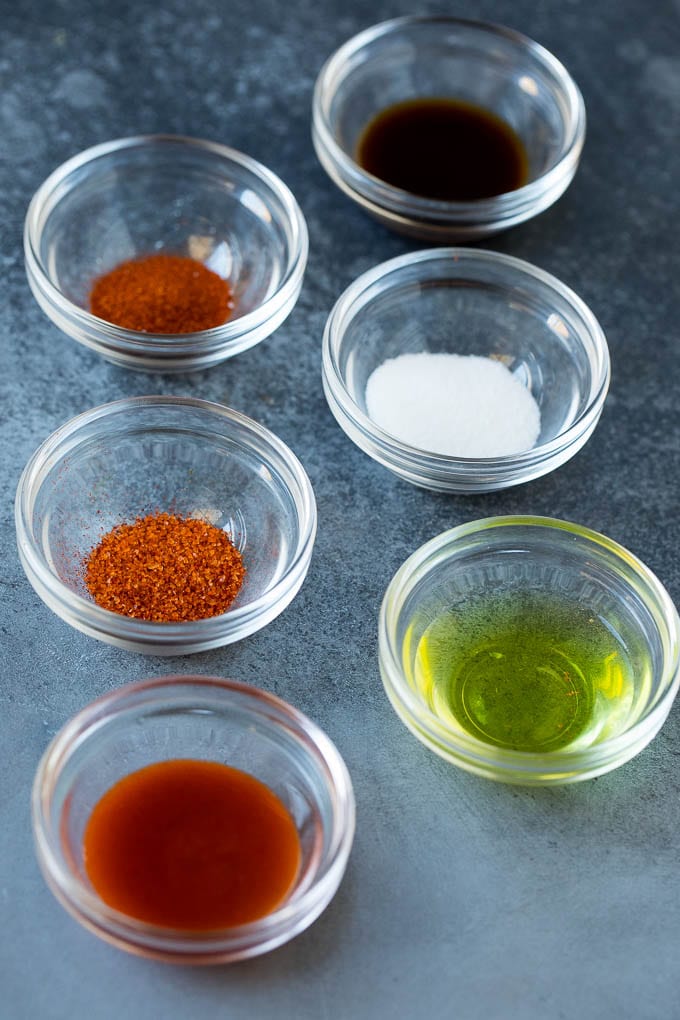 A variety of spices and seasonings in small bowls.