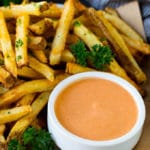 A cup of fry sauce served with homemade french fries.