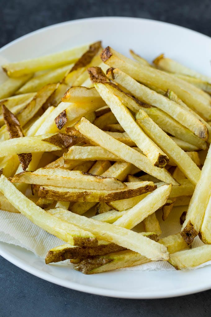 Par-fried potatoes on a plate.