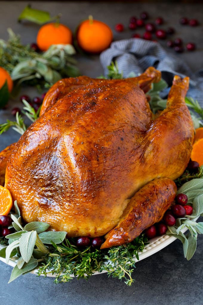 How to cook a turkey with a baked turkey on a serving platter.