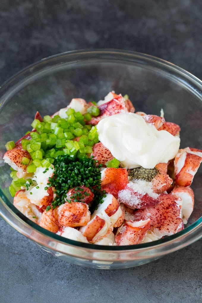 Lobster, chives, celery and mayonnaise in a bowl.