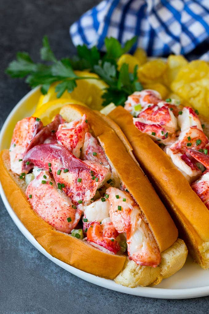 Lobster roll with chunks of fresh lobster meat in a buttered and toasted bun.