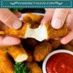 This recipe for mozzarella sticks is cheese coated in seasoned breadcrumbs, then deep fried until golden brown and crispy.