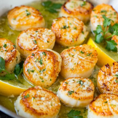 Seared scallops in a lemon garlic sauce with fresh parsley.