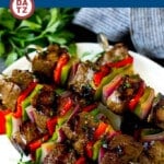 This shish kabob recipe features tender marinated beef, peppers and onions, all skewered together and grilled to perfection.