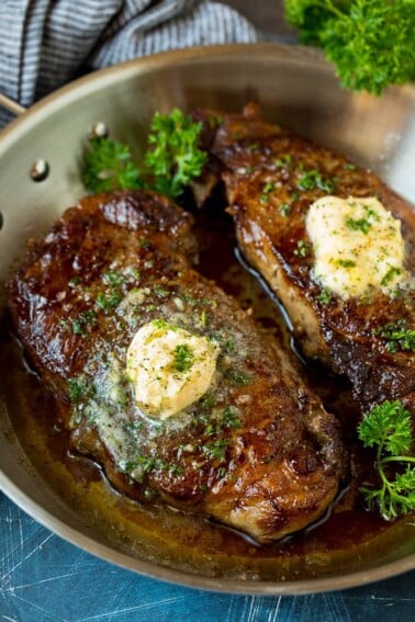 Sirloin steak topped with garlic butter and parsley.
