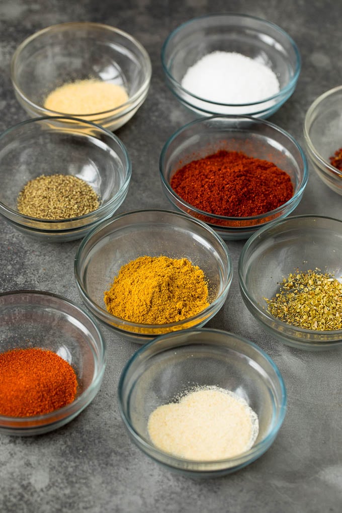 Assorted spices in small bowls.