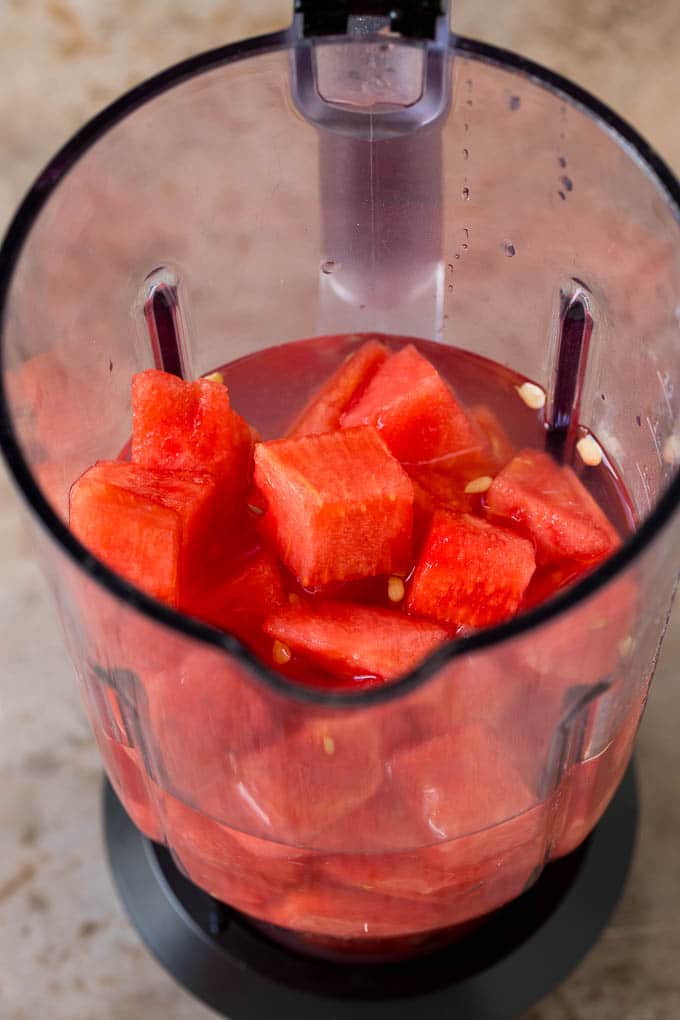 Watermelon cubes, water and sugar in a blender.