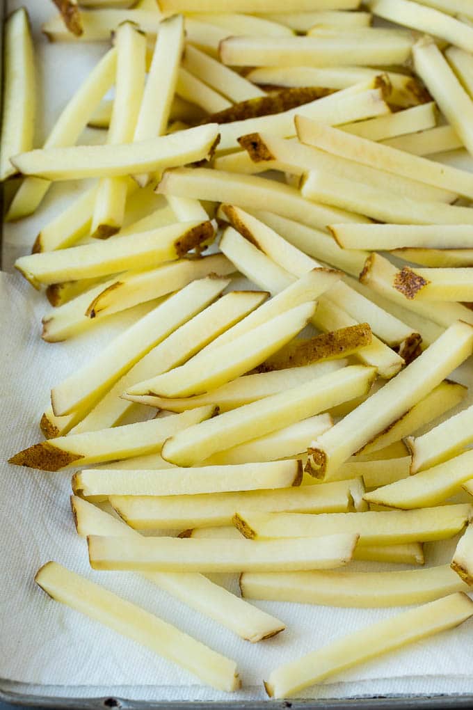 Potato sticks on a paper towel lined pan.