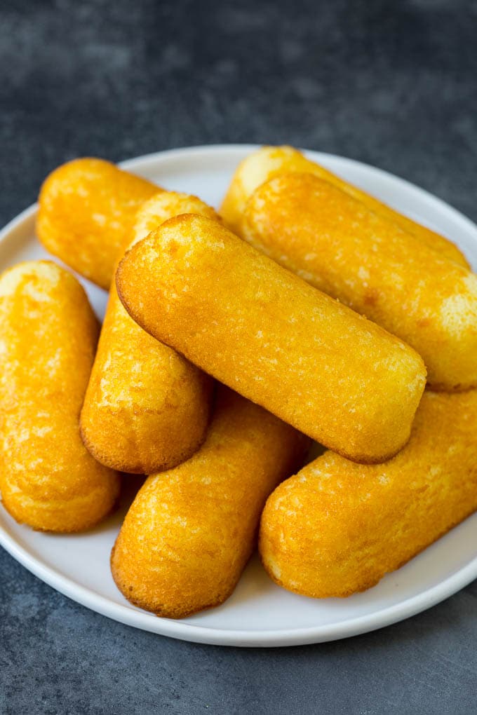 A plate with a pile of Twinkies on it.