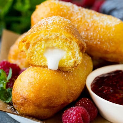 A plate of fried Twinkies served with raspberry sauce.
