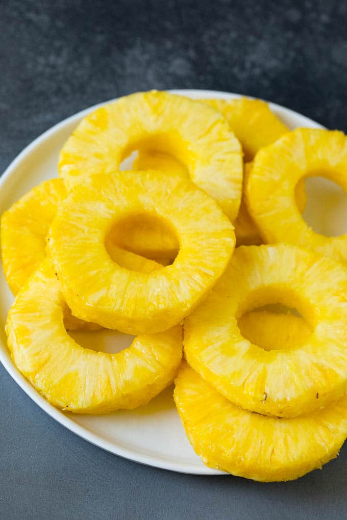 Slices of pineapple on a plate.