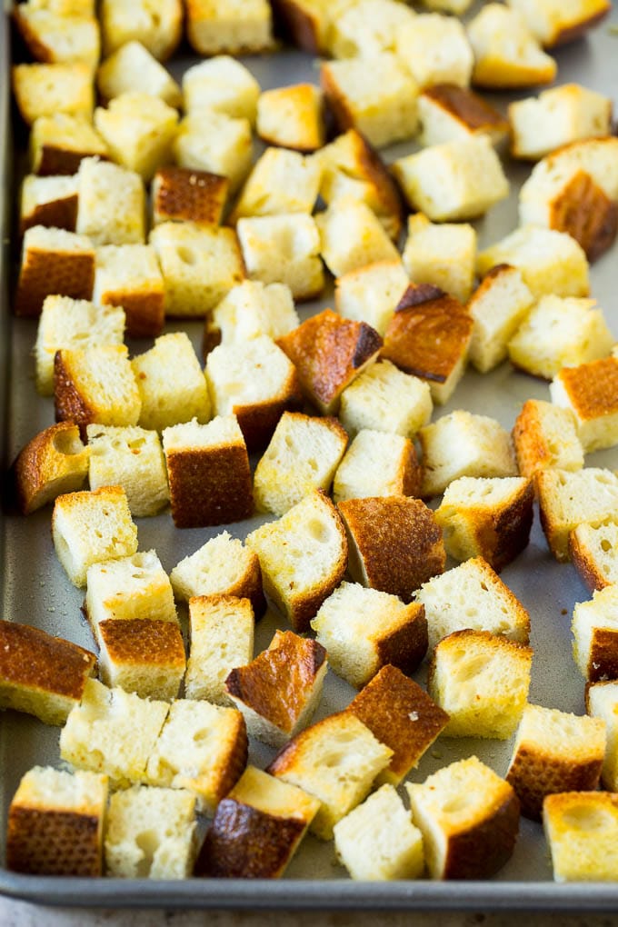 Baked croutons on a sheet pan.