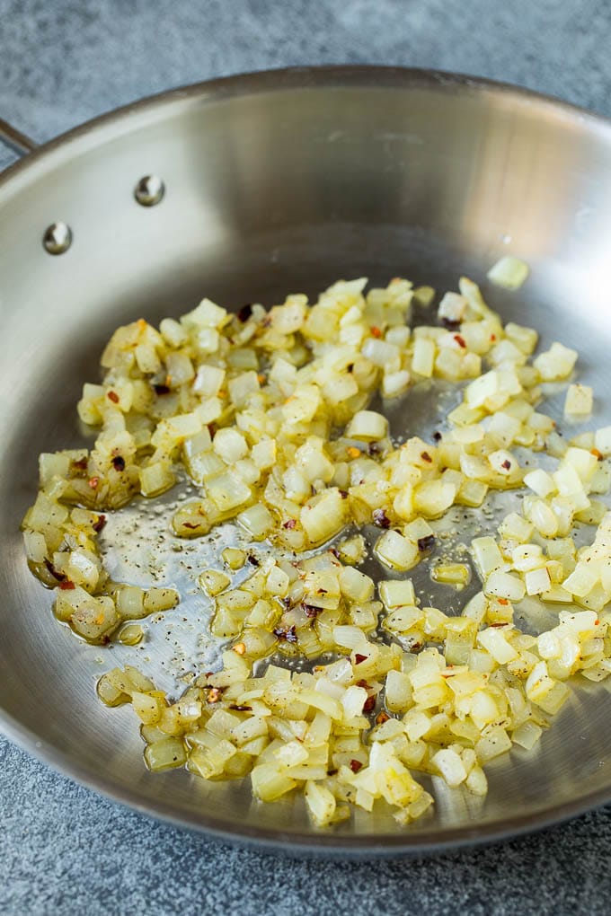 Sauteed onions in a skillet.