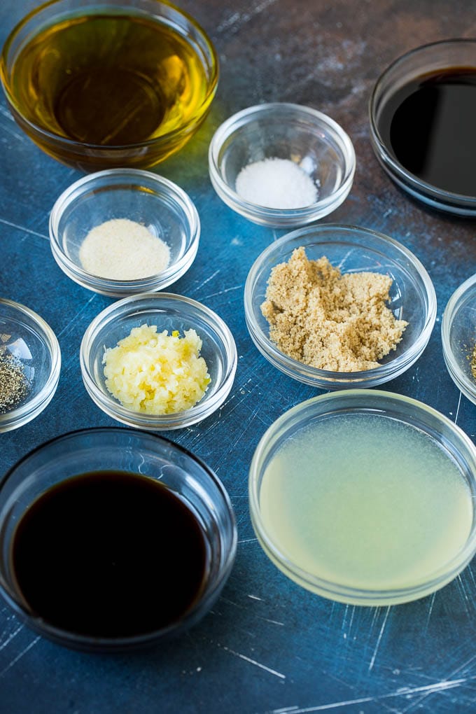 Ingredients in small bowls for a beef marinade.