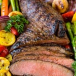 Meat cooked in tri tip marinade sliced and served with grilled vegetables.