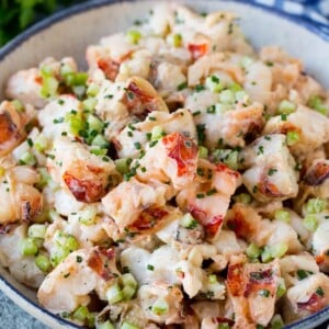 A bowl of lobster salad in a creamy dressing.
