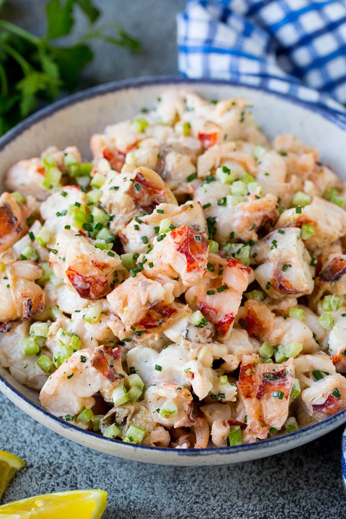 A bowl of lobster salad in a creamy dressing.