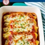 This manicotti recipe is Italian sausage with three kinds of cheese, stuffed into pasta then covered with sauce and baked to perfection.
