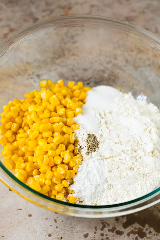 Flour, corn and seasonings in a mixing bowl.