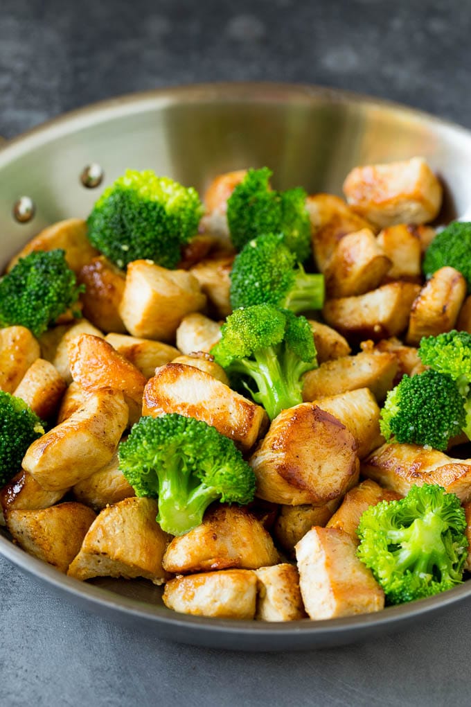Chicken, broccoli, ginger and garlic in a pan.