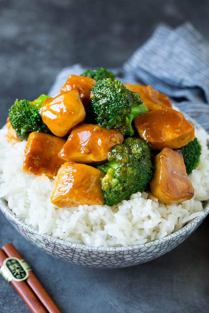 A bowl of ginger chicken served over steamed rice.