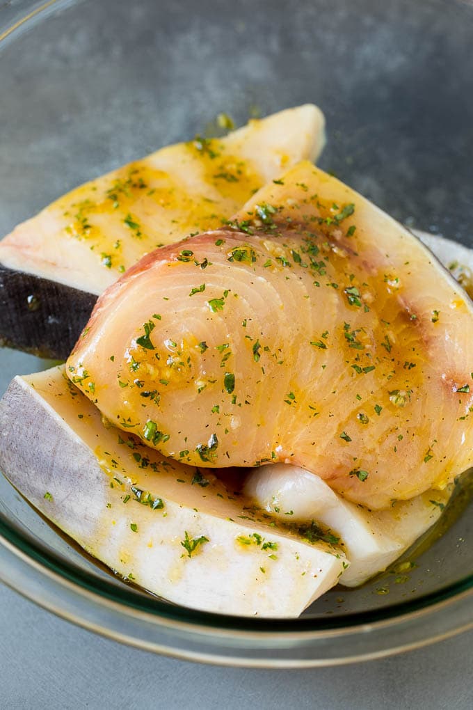 Swordfish steaks in a garlic and herb marinade.