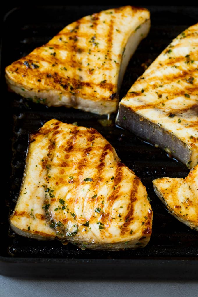 Swordfish steaks cooked on a grill pan.