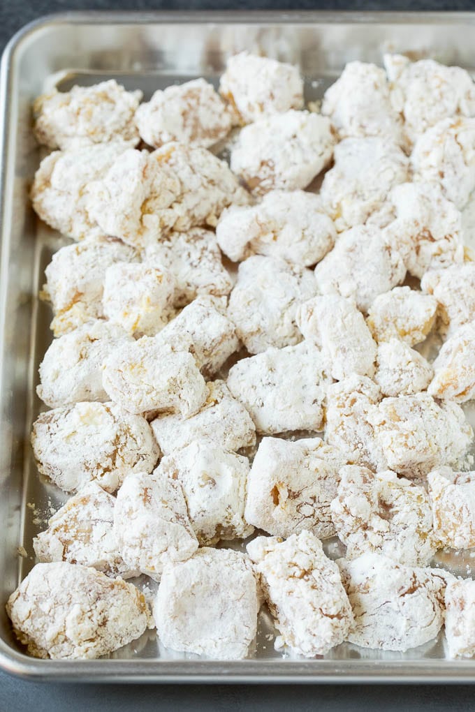 Chicken pieces coated in corn starch and flour.