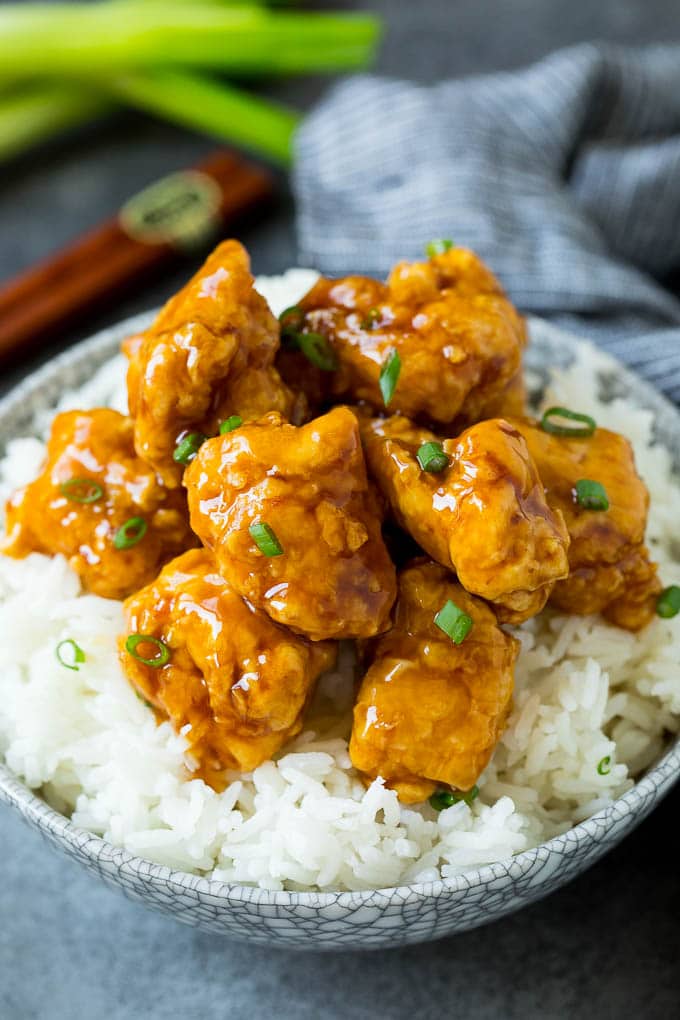 Honey chicken served over a bowl of steamed rice.