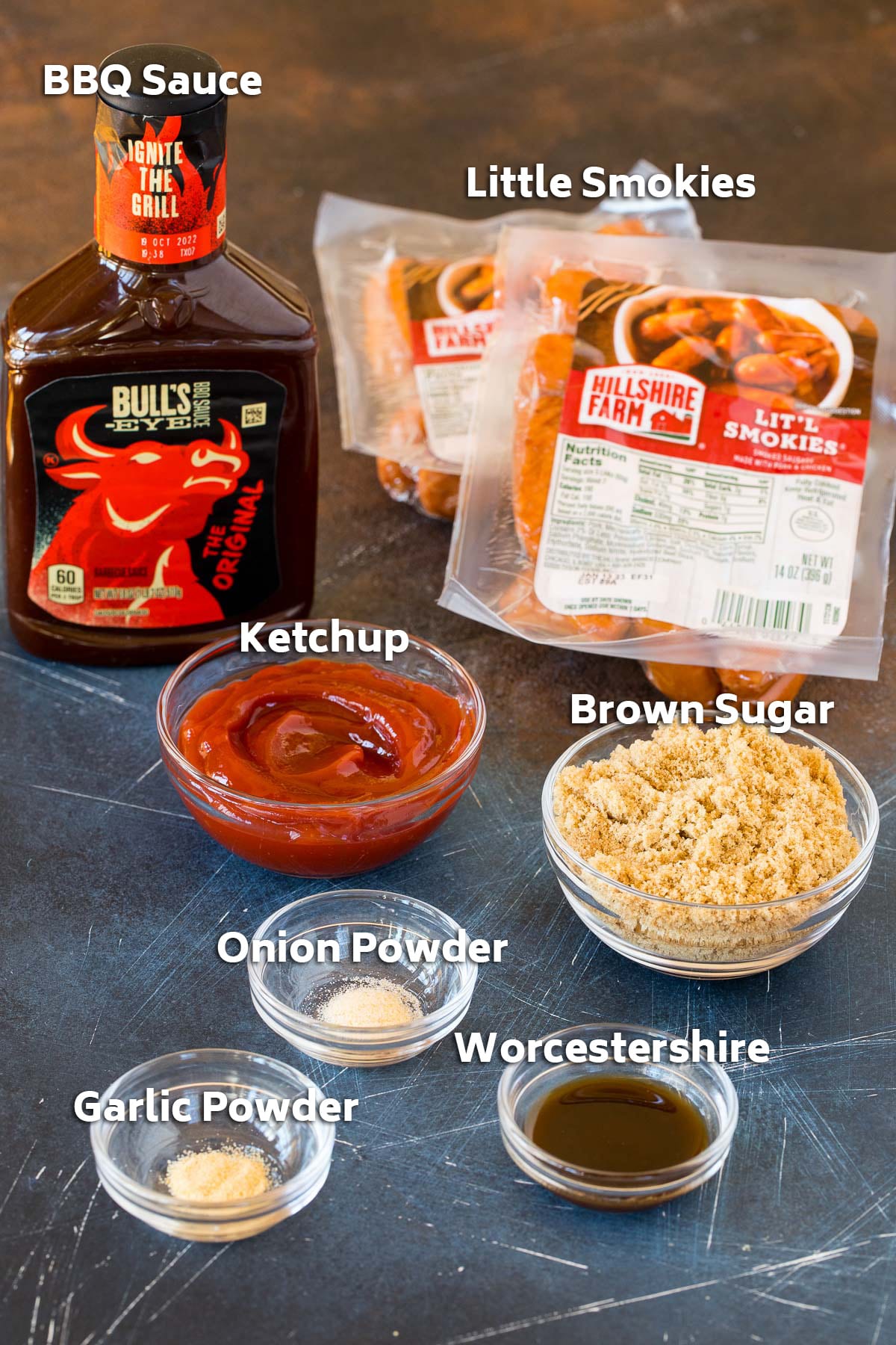 Ingredients including sausages, barbecue sauce, ketchup and seasonings.