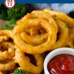 These onion rings are coated in beer batter and deep fried until golden brown.