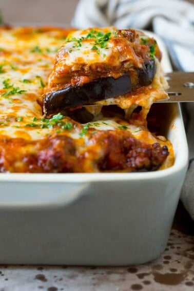 A spatula serving up a portion of eggplant lasagna.