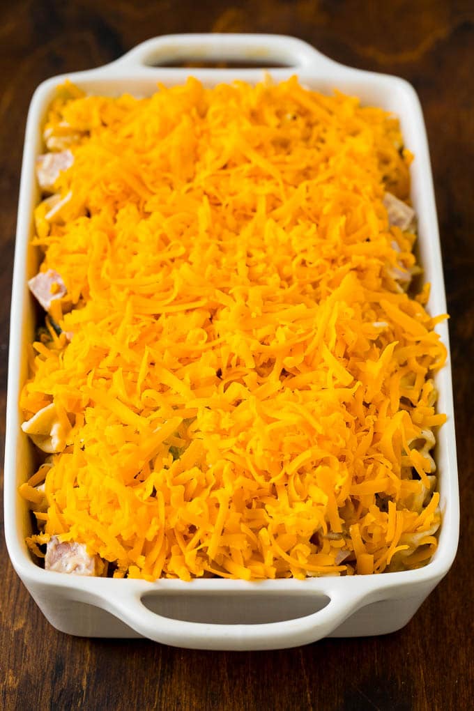 Ham and noodles in creamy sauce, topped with shredded cheddar cheese.