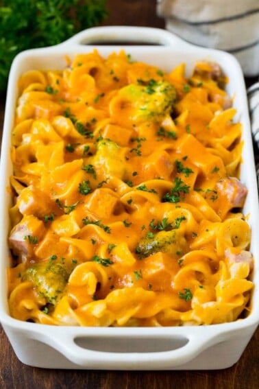 Ham casserole with egg noodles and broccoli, topped with melted cheese.