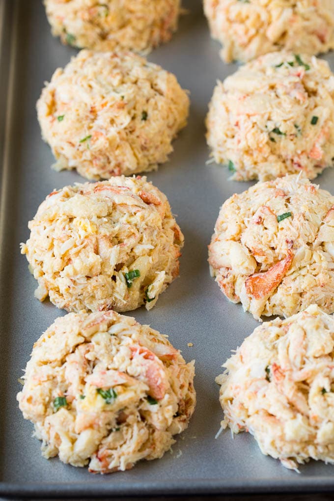 Crab patties on a sheet pan.