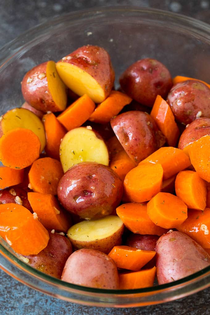 Red potatoes and slices of carrot tossed in garlic, herbs and oil.