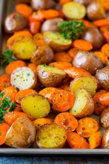 Roasted potatoes and carrots with garlic and fresh herbs.