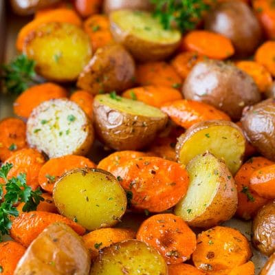 Roasted potatoes and carrots with garlic and fresh herbs.