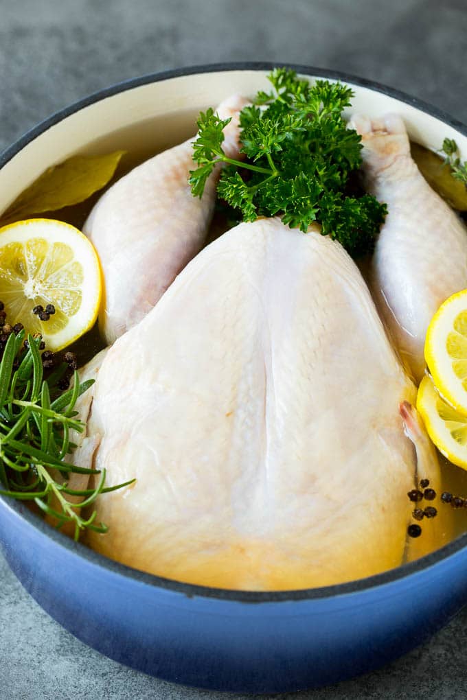 A chicken in a pot of brine.