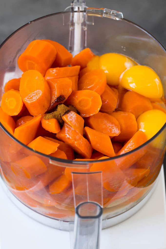 Cooked carrots, eggs, butter and spices in a food processor.