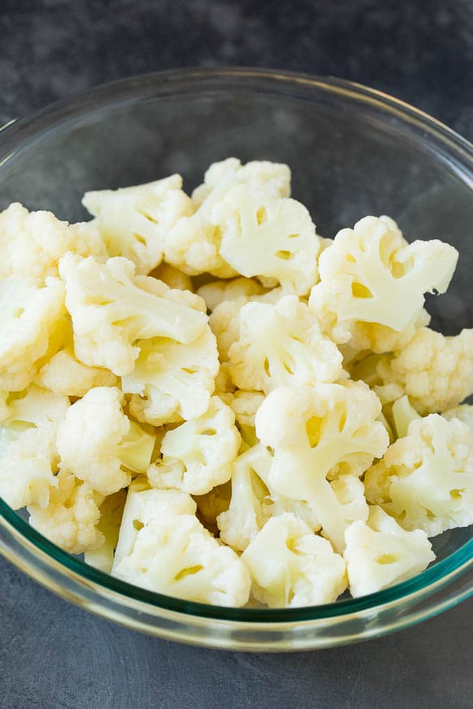 Cooked cauliflower florets in a bowl.