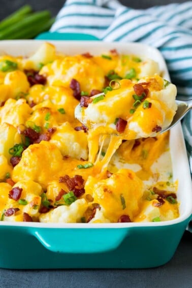 A spoon serving up a portion of cauliflower casserole.