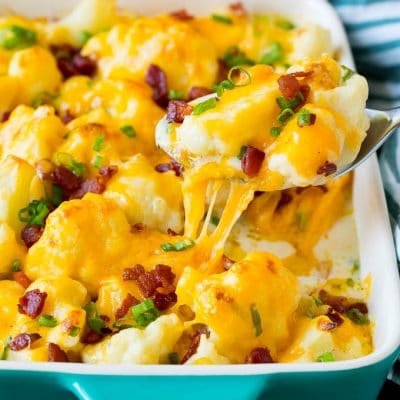 A spoon serving up a portion of cauliflower casserole.